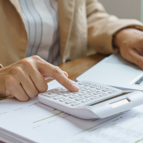 older adult comparing prescription costs on laptop